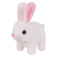 Electric realistic rabbit plush toy in plush material with carrot accessory on white background