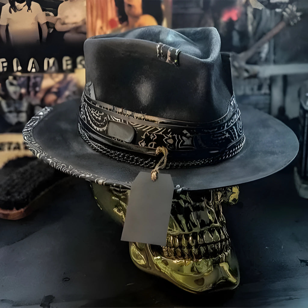 Handmade black wool felt skull hat with conical crown and blue denim accent band, shown from the side.
