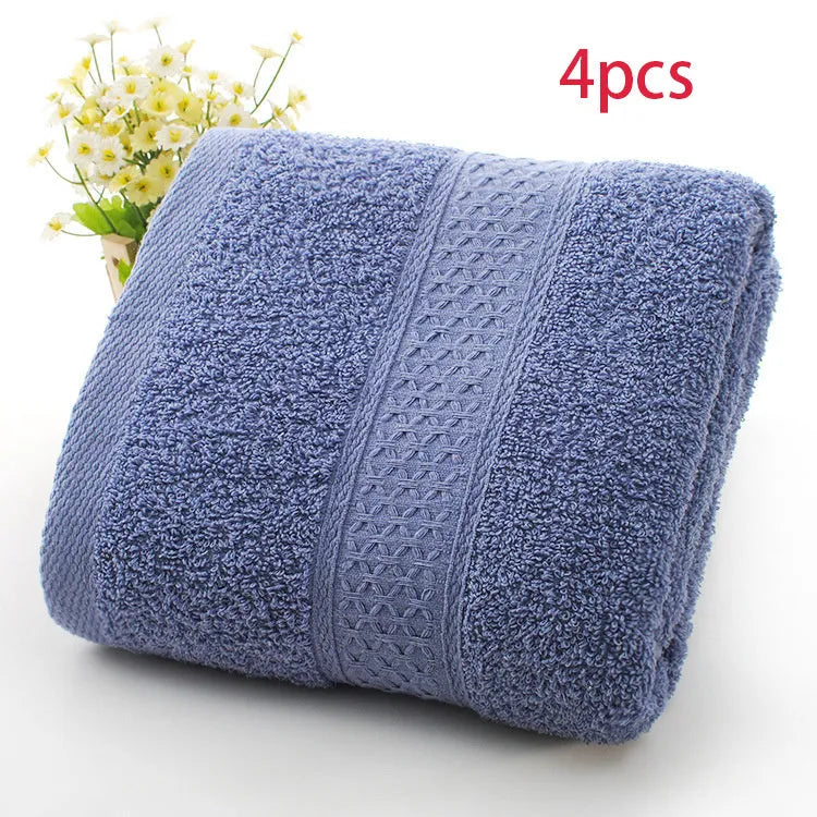 Thick bath and beach towels in seven colour options including apple green, dark blue, and light pink