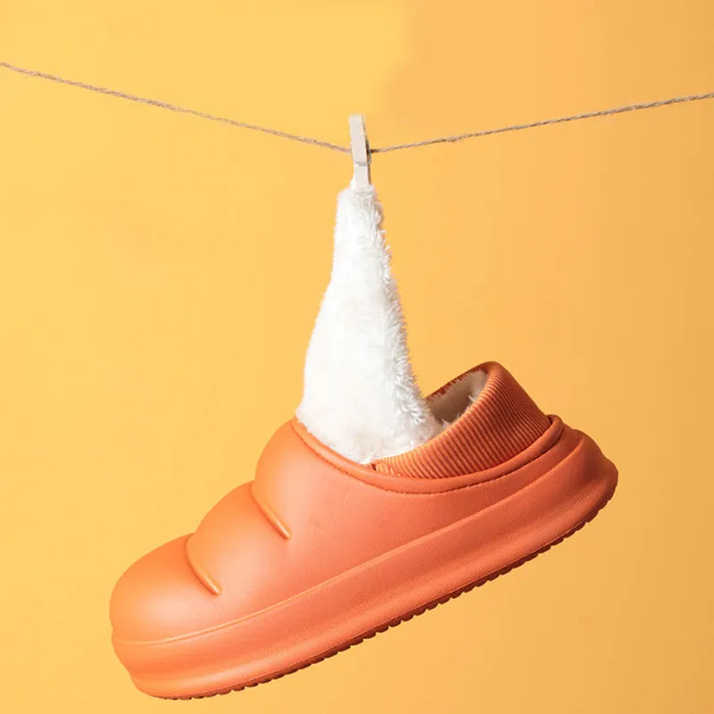 Green waterproof EVA cotton slipper with plush lining, flat sole, and hollow slip-on design.