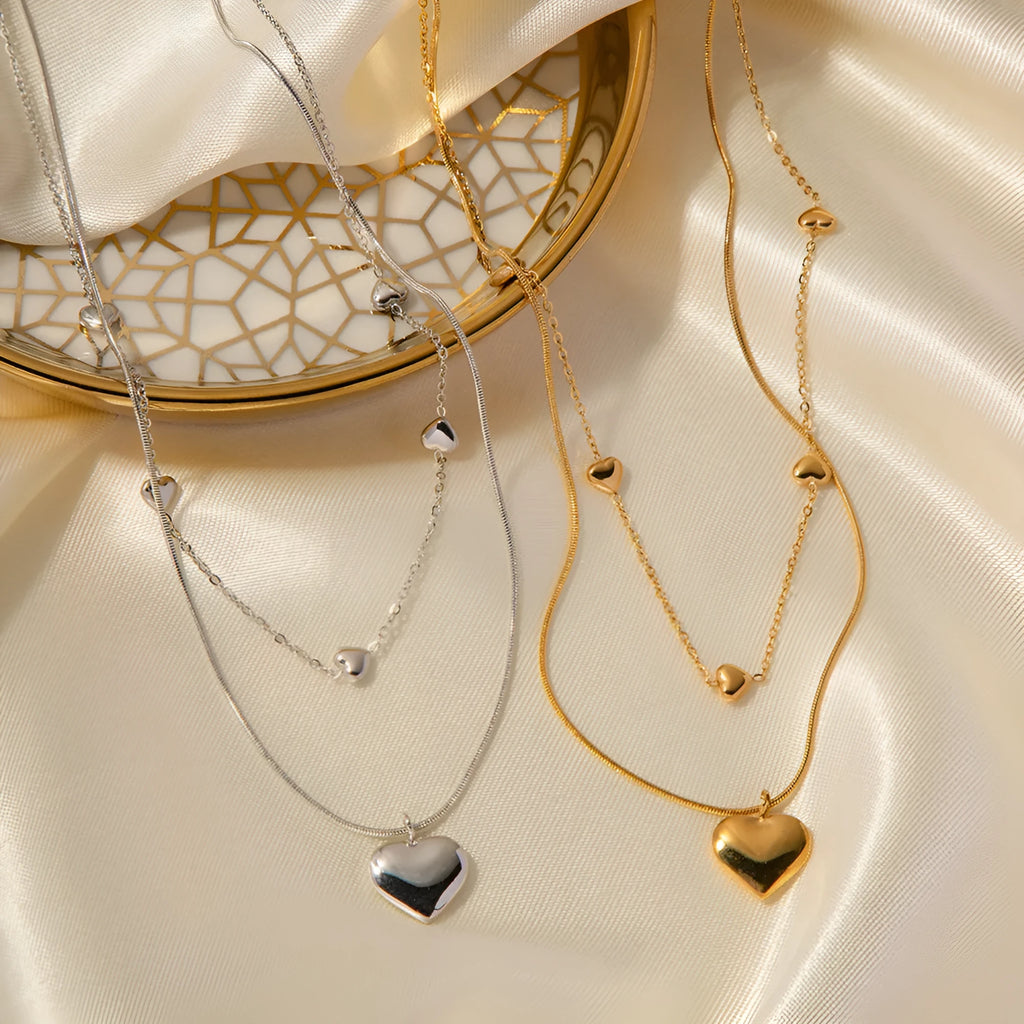 Love double-layer 18K gold-plated collarbone necklace with snake pendant for women on display