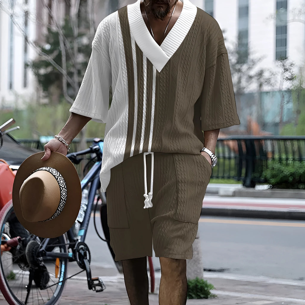 Man wearing a printed drop-shoulder knitted short-sleeve top with matching shorts.