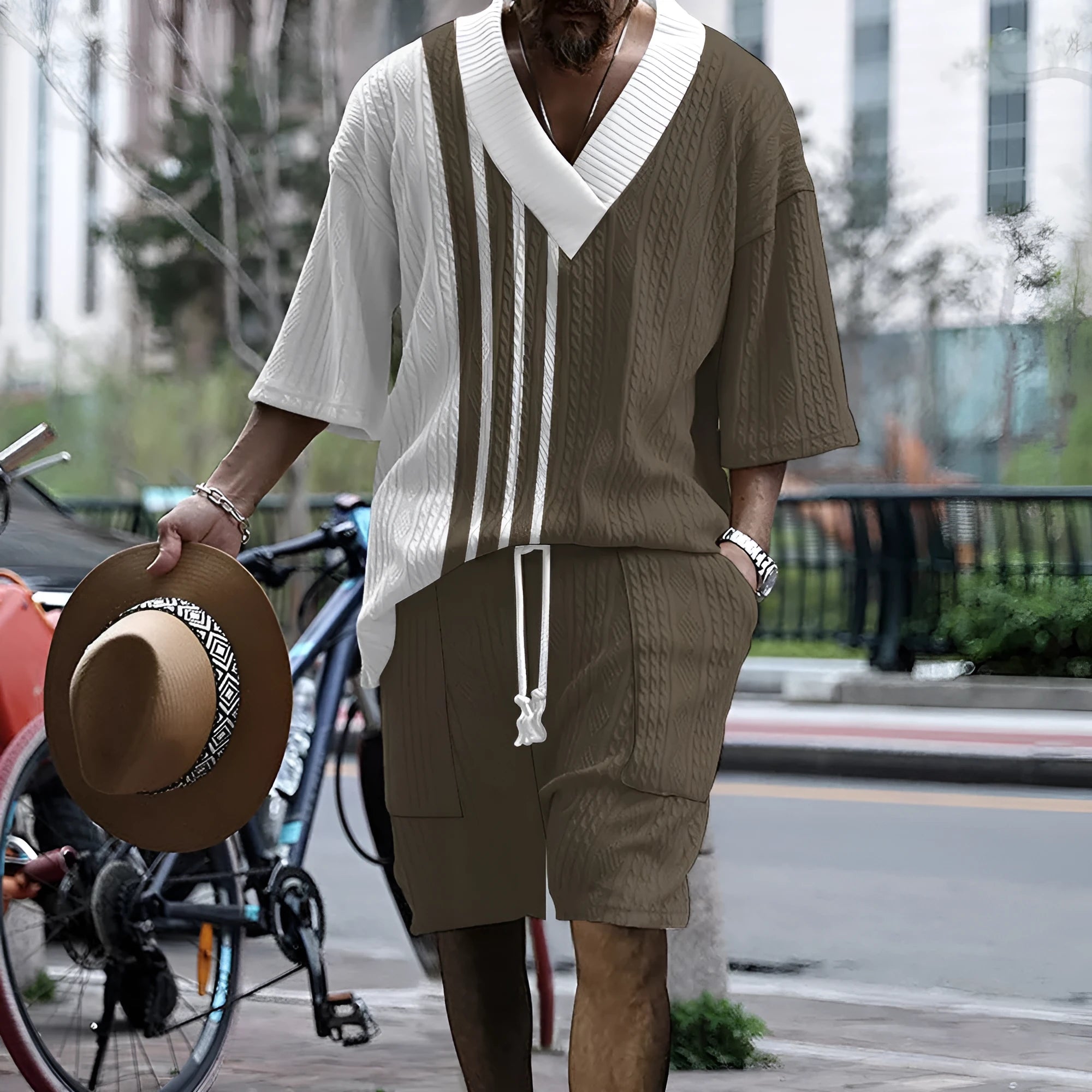 Man wearing a printed drop-shoulder knitted short-sleeve top with matching shorts.