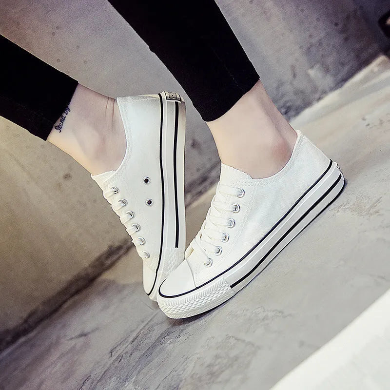 Women's solid colour canvas casual shoes in multiple colour options on a white background.