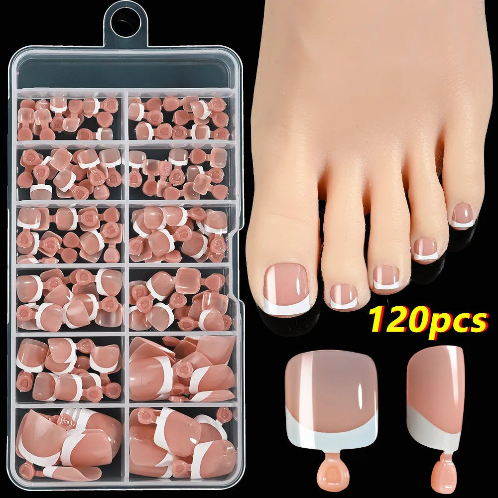 120 piece boxed set of full square short artificial toenails with French white edge design on nude base