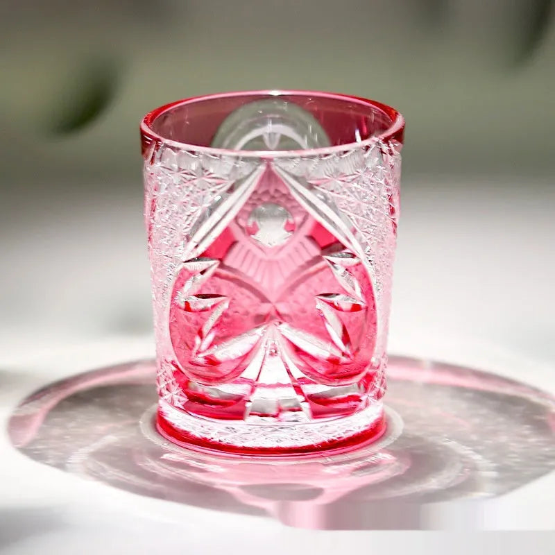 Crystal glass hand carved golden red owl wine glass with 201-300ml capacity on a table
