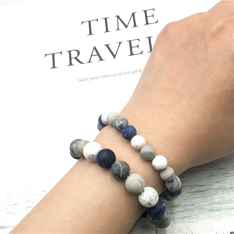 Handmade planet stone men's bracelet in U-shape, S228 Universe Wind design on wrist.