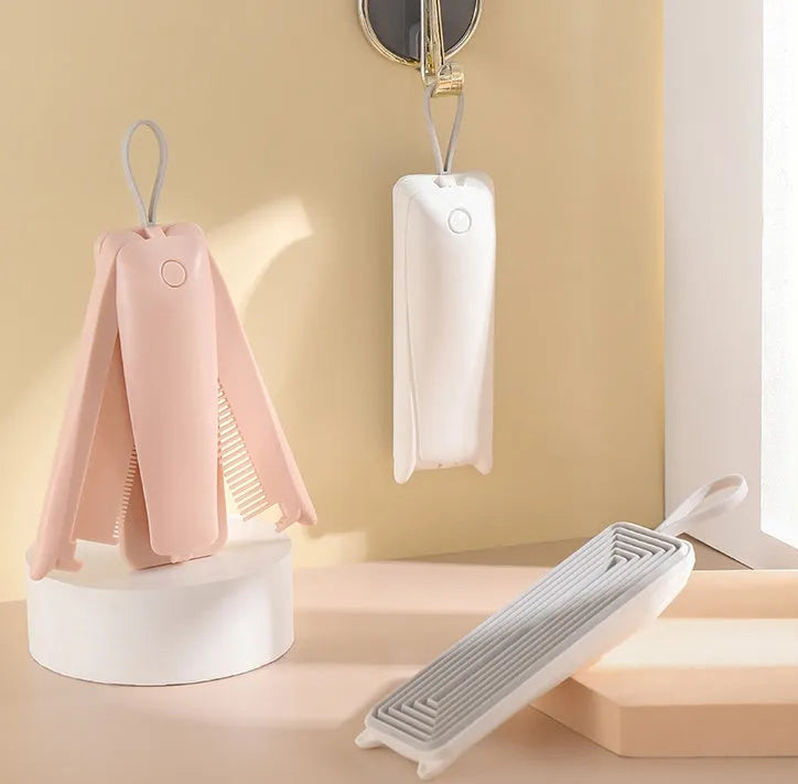 ABS plastic pet grooming brush for removing hair from cats and dogs in pink and white colours
