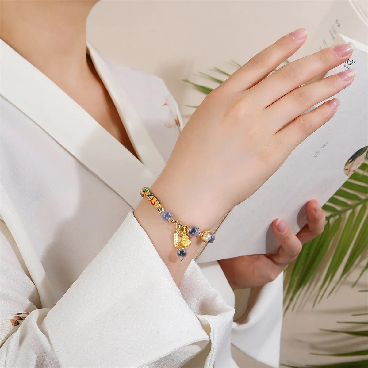 Handmade sugar heart agate bracelet with retro ethnic design on a wrist.