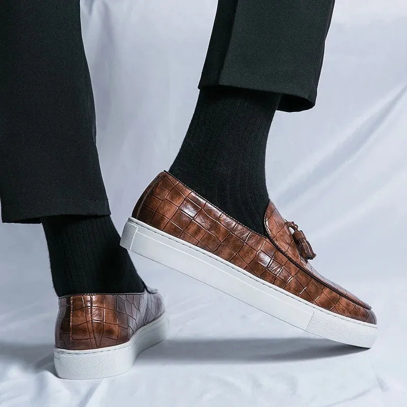 Men's plus size brown leather-look sneakers with tassel detail and rubber sole.