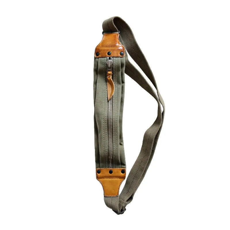 Green American retro military style chest bag with washed canvas and cowhide leather details