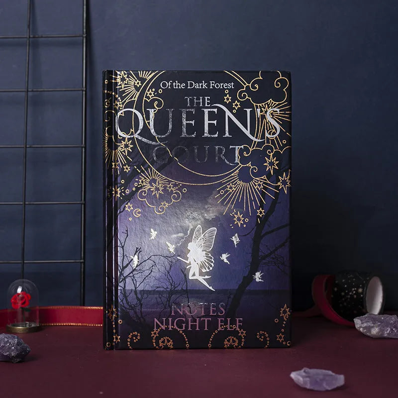 Blue and purple luminous hardcover A5 notebooks open to show full-colour illustrated pages