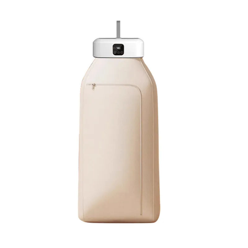 White cylindrical foldable laundry dryer with remote control on a table.
