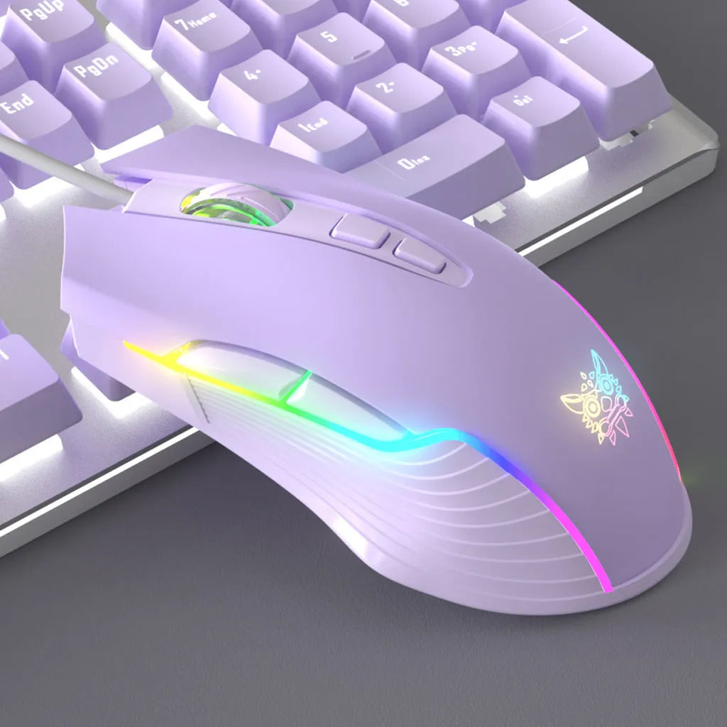 White and purple backlit wired mechanical keyboard and mouse gaming bundle on a desk.