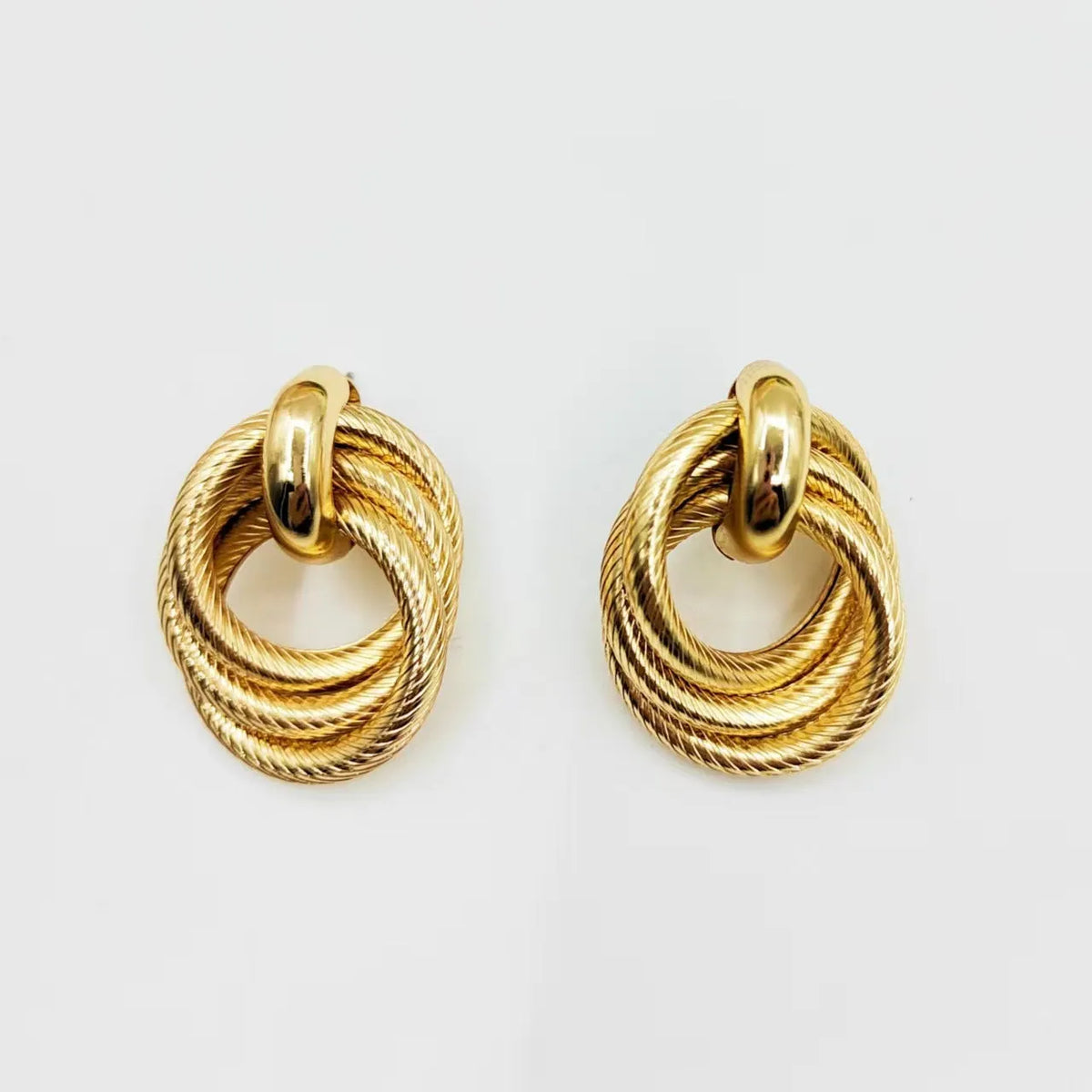 Gold electroplated geometric ring embossed twisted stud earrings for women, one pair