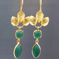 Gold retro women's drop earrings with French leaves and water drop zircon pendants on a copper base.