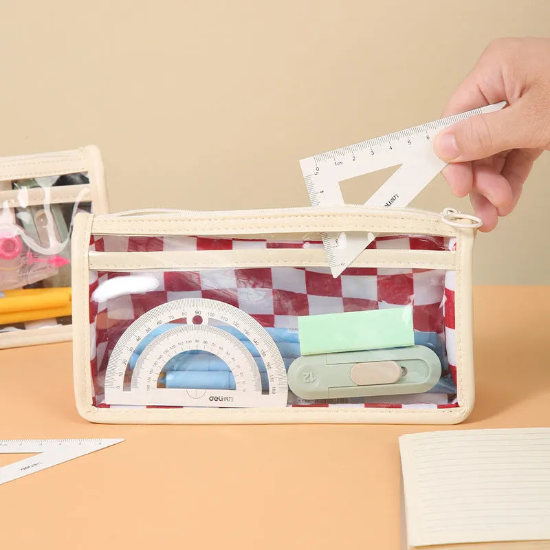Transparent PVC pencil case with chessboard grid pattern, showing pens inside.