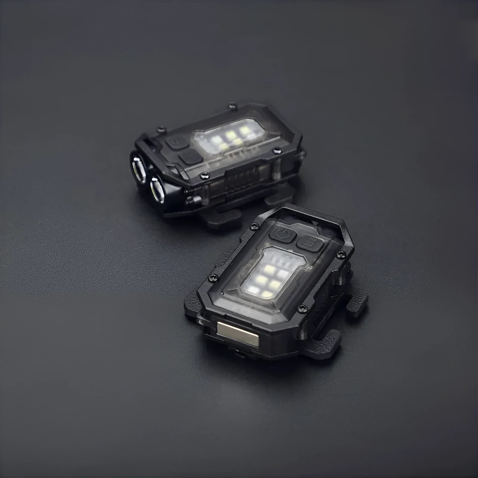 Mini tactical flashlight with USB charging cable showing dual lighting modes and backpack mount attachment point