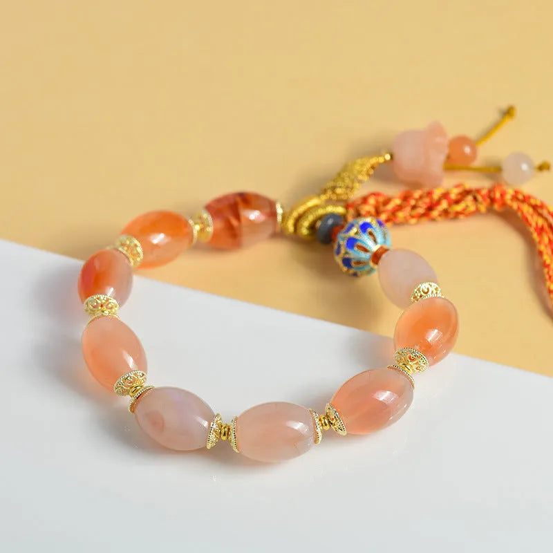 Vintage Tibetan agate bracelet with floral and geometric patterns including lily motif