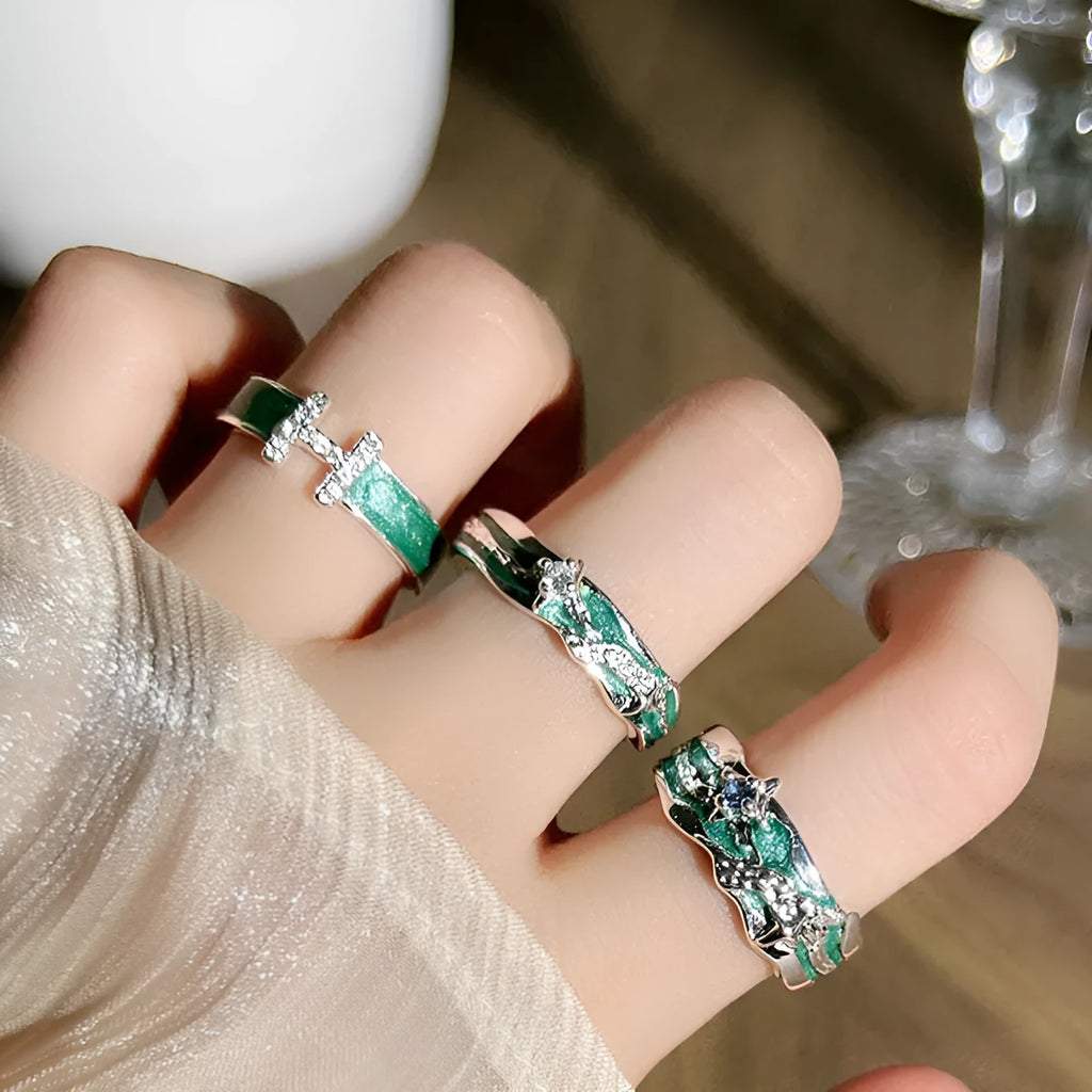 Mint green enamel asterism ring with asymmetric folded copper design and eight-point star pattern