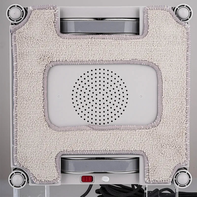 White intelligent window cleaning robot device for automated high-rise window washing.