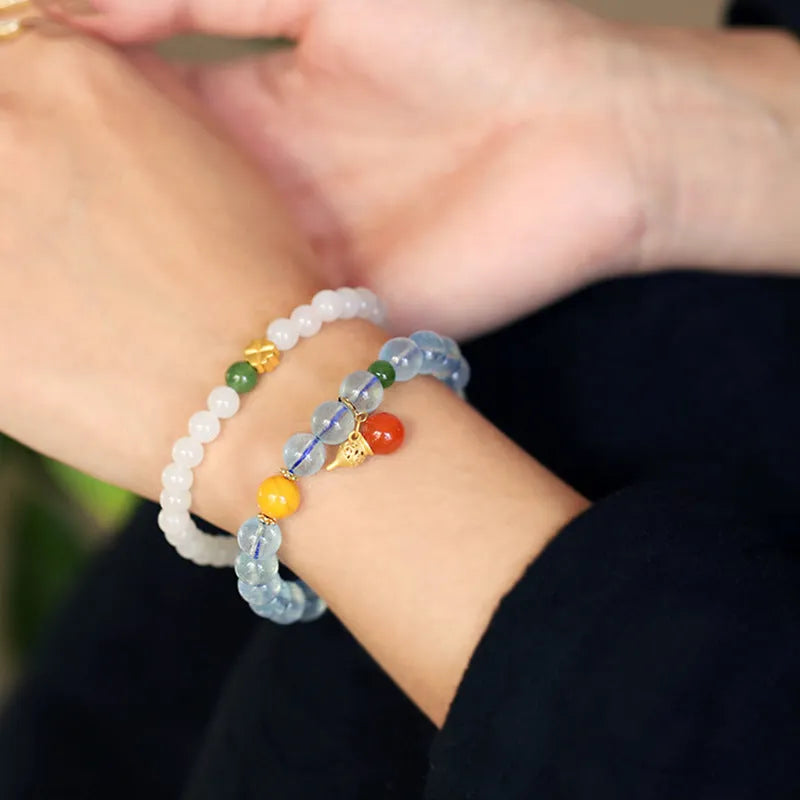 Iced aquamarine crystal bracelet with geometric arrangement of 8mm stones and adjustable cord