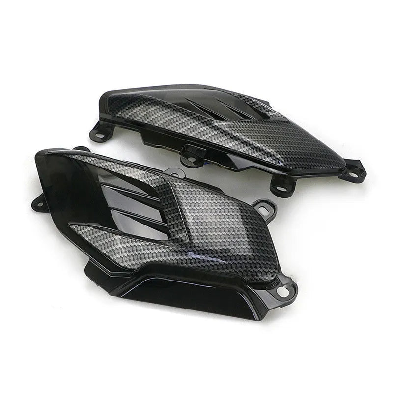 Pair of Yamaha NMAX scooter side lamp units with carbon fibre pattern and blue LED illumination