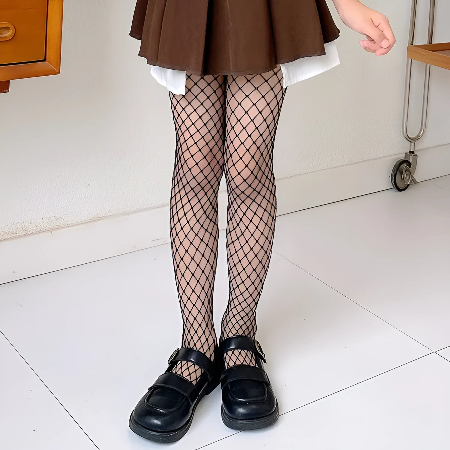 Women's black and white mesh stockings showing large, medium, and small net patterns in thin velvet polyester fabric.