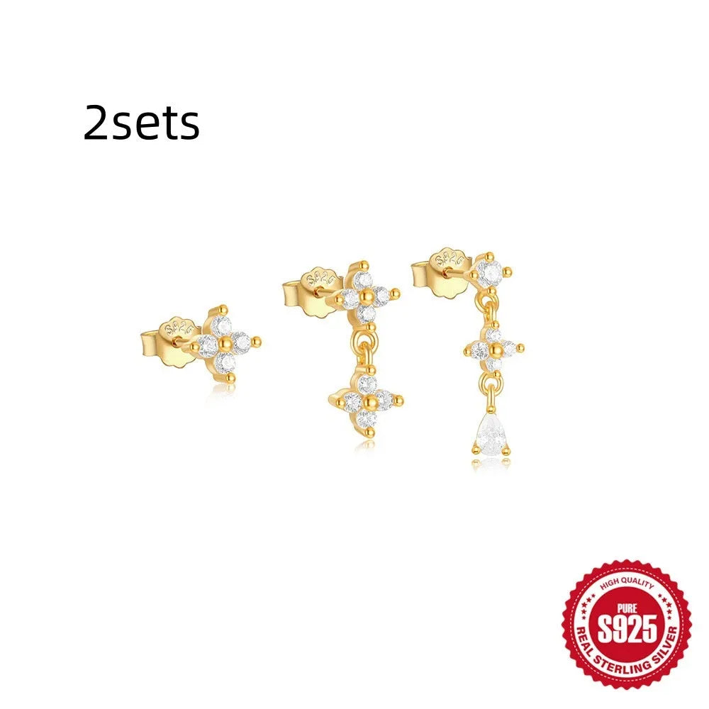Set of three S925 sterling silver geometric zircon tassel earrings for women on a plain background.