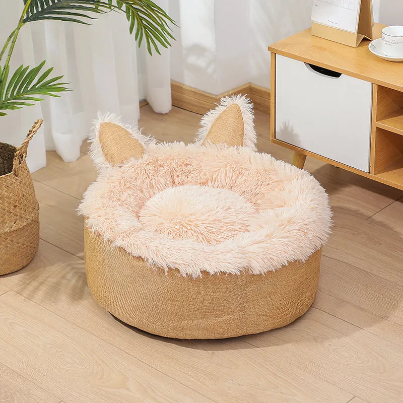 Round plush faux fur cat bed with raised sides in blue colour showing soft texture