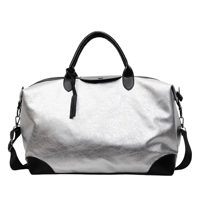 36-55L capacity hand-carry travel bag in black or silver with PU construction and polyester lining