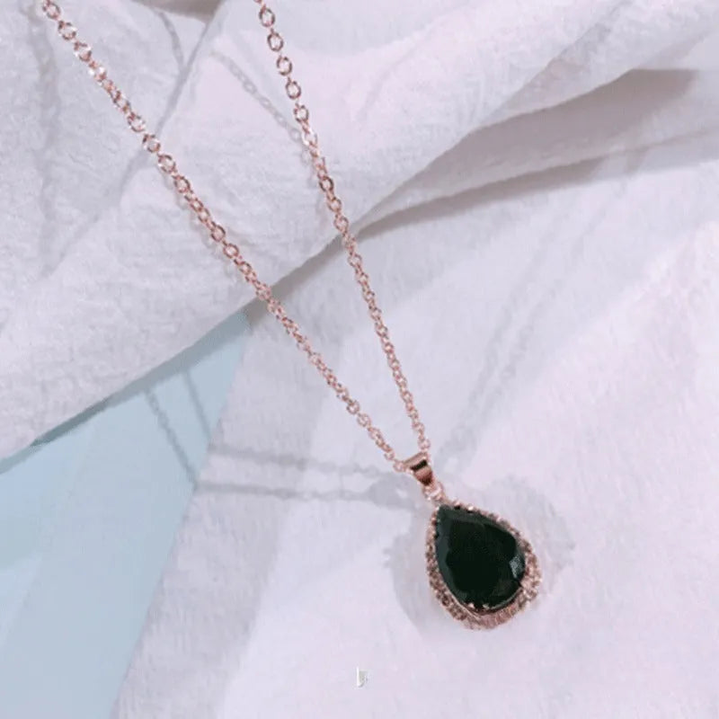 Women's rose gold geometric drop necklace with rhinestone inlay in pink colour