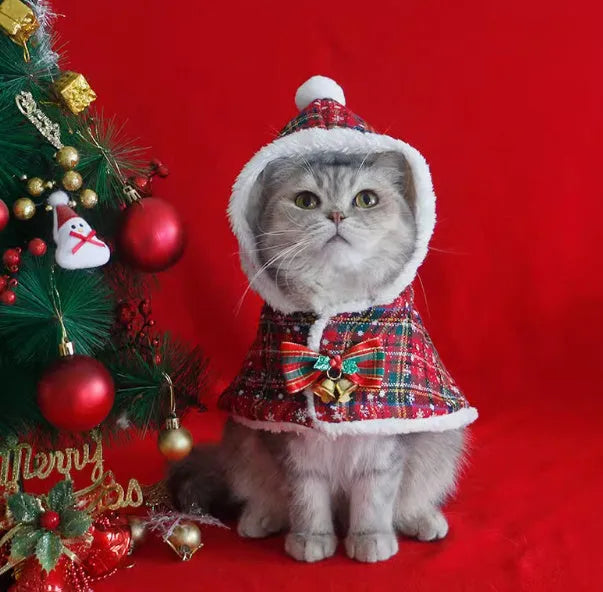 Red polar fleece Christmas cloak with hood and antlers on a dog, showing sizes S M L XL.