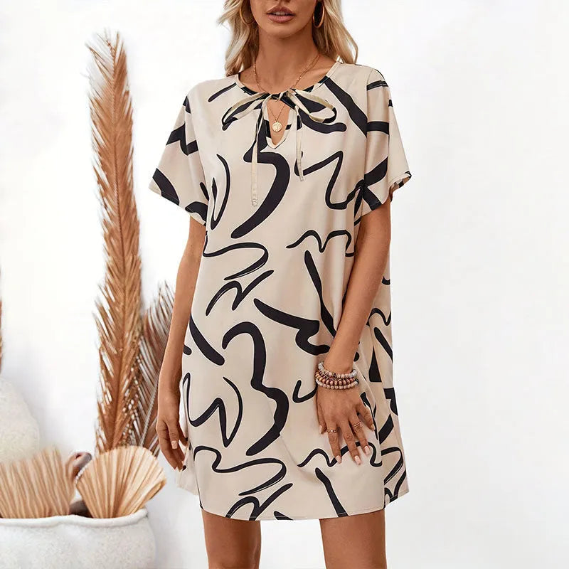 Khaki colour block print stretch polyester pencil dress with raglan sleeves on a model