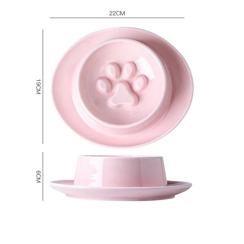 Green ceramic anti-choking slow food bowl for cats and dogs on a flat surface.