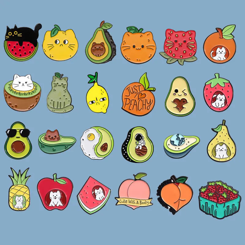 Colourful cartoon-style fruit metal brooch with pin back on a denim jacket lapel.