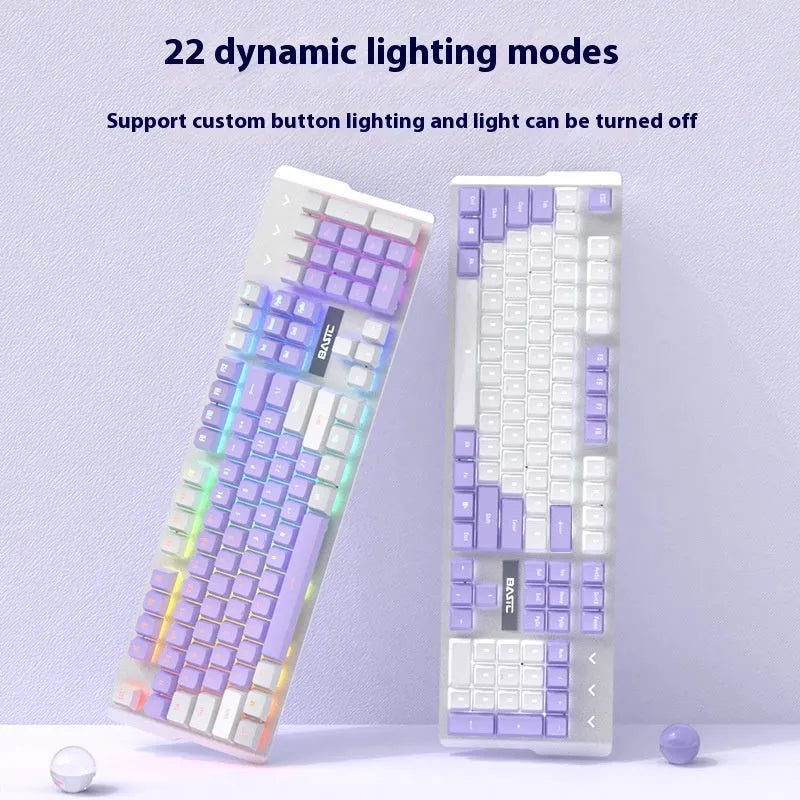 White and purple backlit wired mechanical keyboard and mouse gaming bundle on a desk.