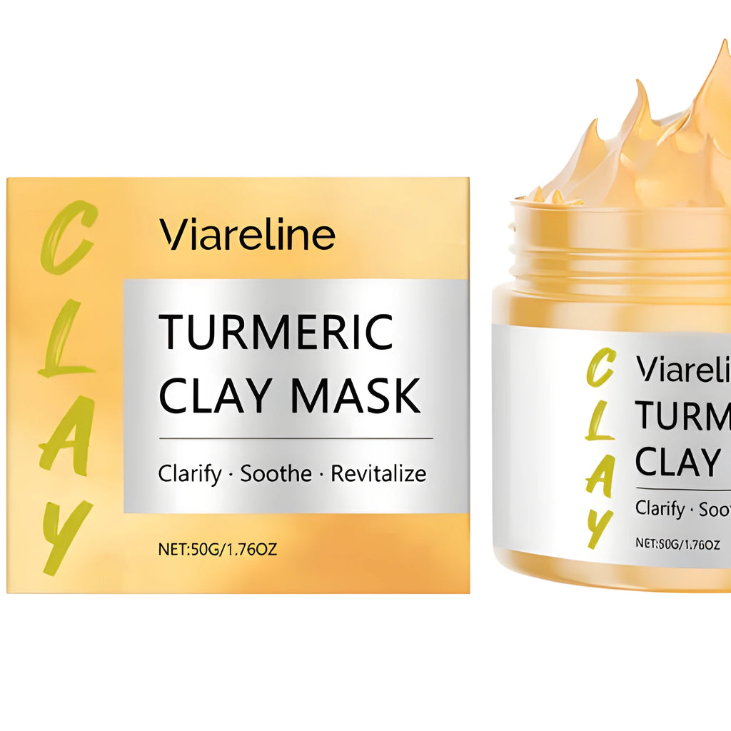 Yellow turmeric mud mask in a tub with an application brush.