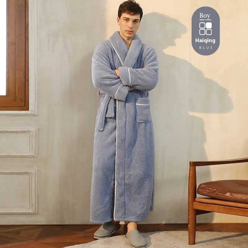 A man and woman wearing matching heavyweight navy blue flannel bathrobes, a couple's winter nightgown set.