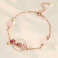 Women's S925 sterling silver bracelet with white chalcedony crystals and electroplated koi fish design.