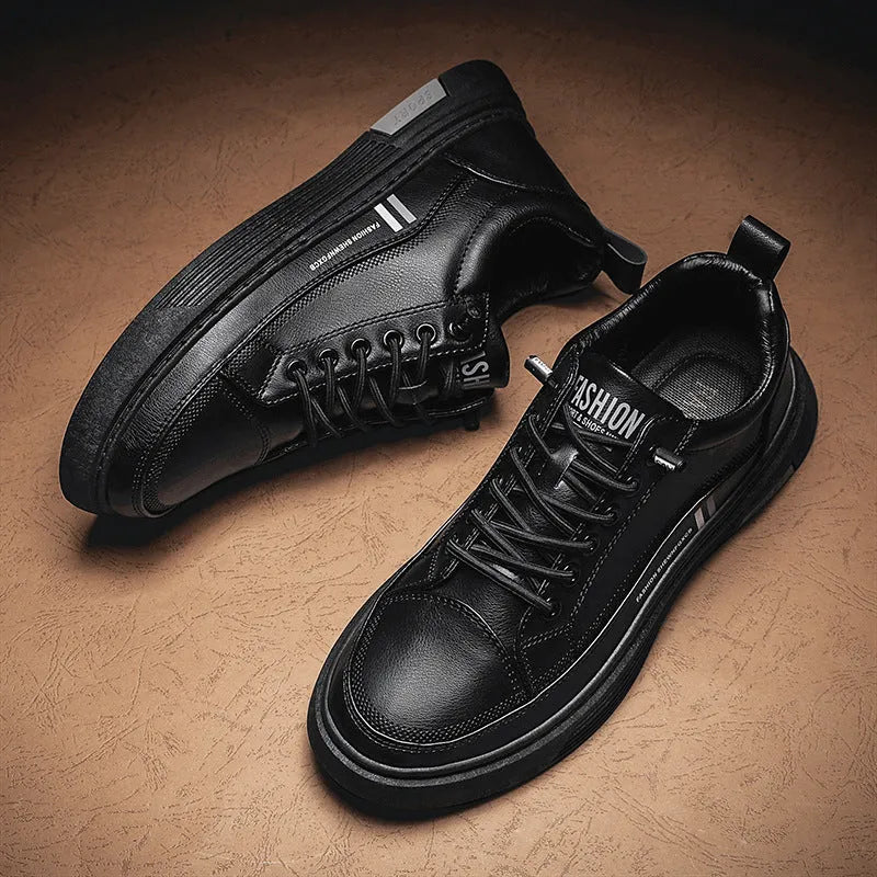 Men's white and black low-top skateboard shoes with an elastic band closure and round toe.