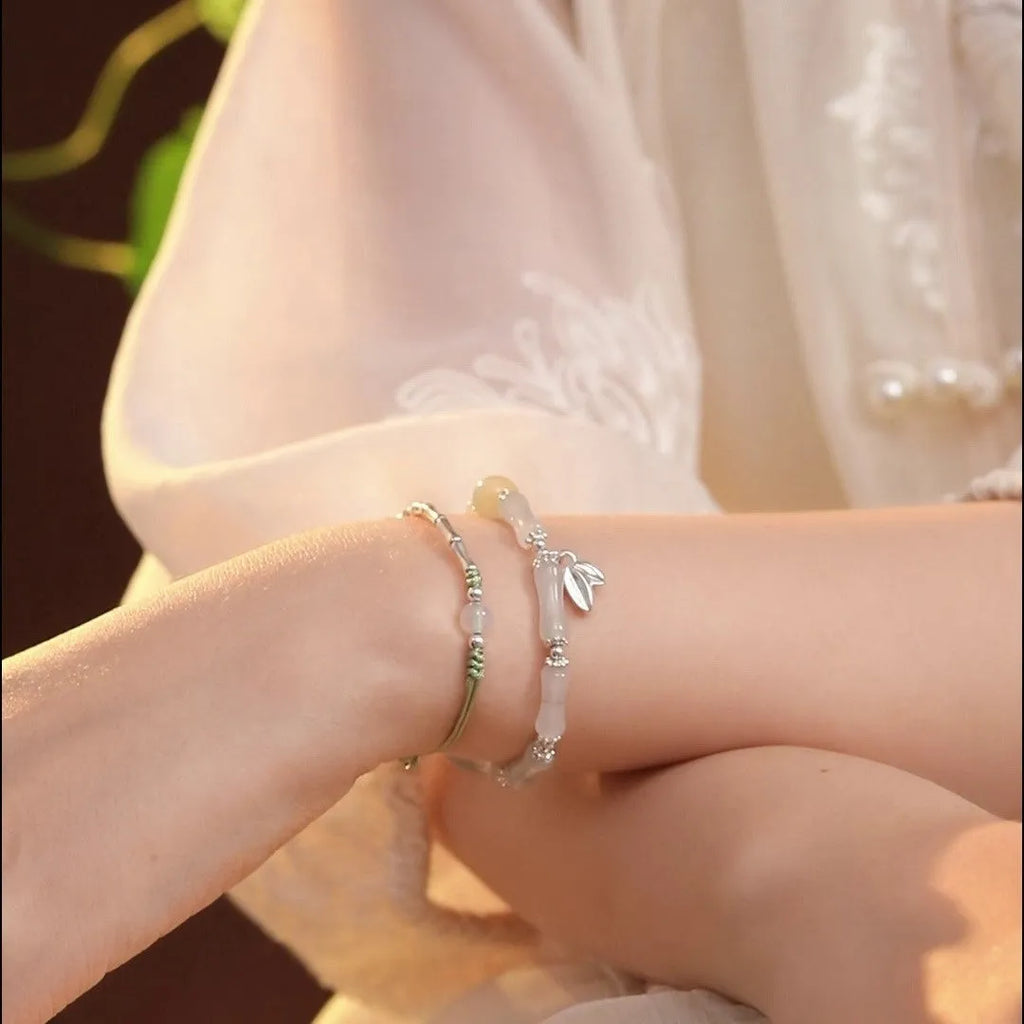 Women's antique style bracelet made from Tianshan green bamboo and sterling silver with bamboo joint detailing
