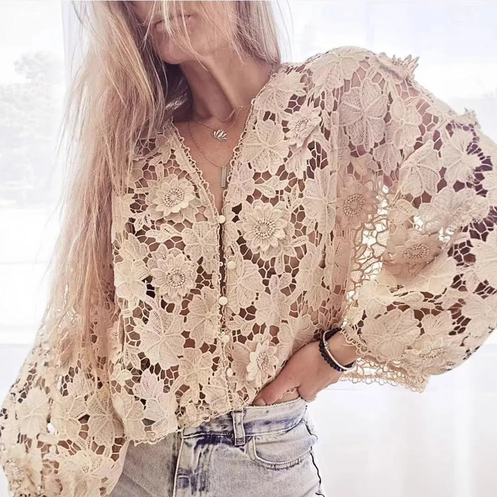 A women's loose black lace cardigan with a V-neck and three-dimensional floral decoration on the front.