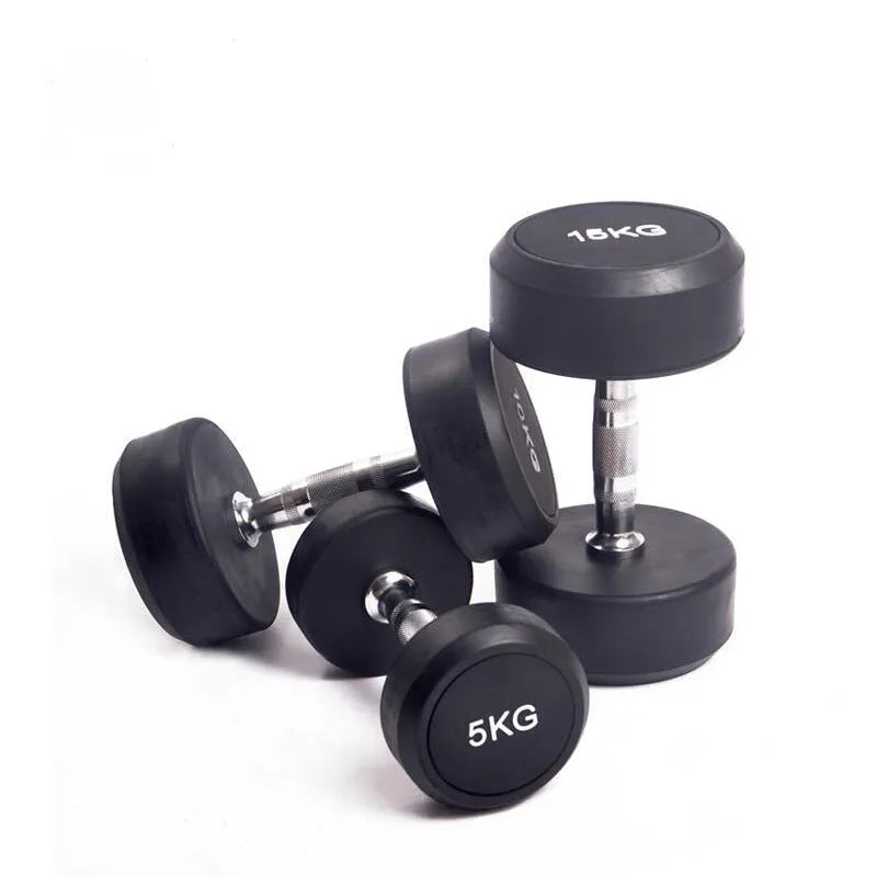 Black rubberized cast iron round head dumbbell on floor, available in 1kg 2.5kg and 5kg weights