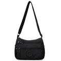 Soft water-repellent nylon crossbody bag showing three-dimensional pocket and adjustable shoulder strap