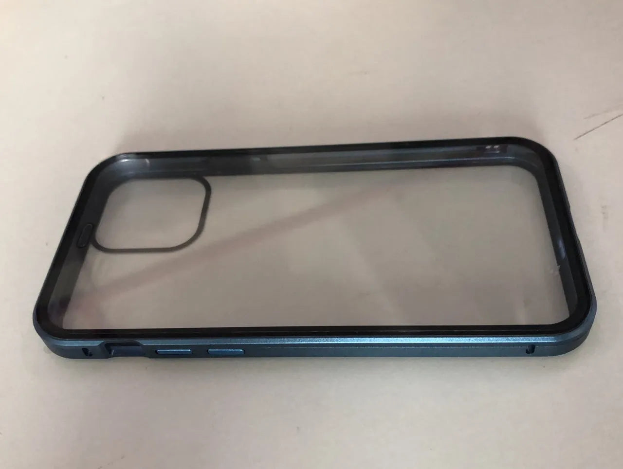 Geometric-patterned clamshell phone case in navy blue, open to show iPhone 13 Pro Max inside.