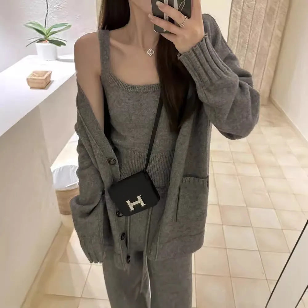 Women's knit three-piece set with cardigan, vest, and suspender pants in wool blend fabric
