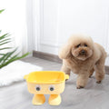 Green robot-shaped elevated cat bowl with tilted design and detachable inner section