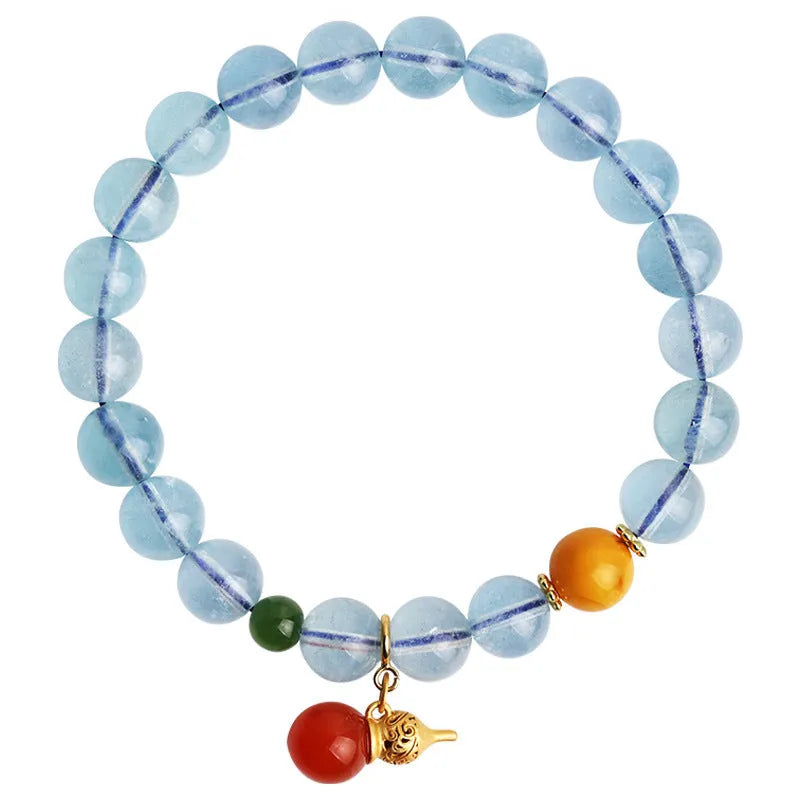 Iced aquamarine crystal bracelet with geometric arrangement of 8mm stones and adjustable cord
