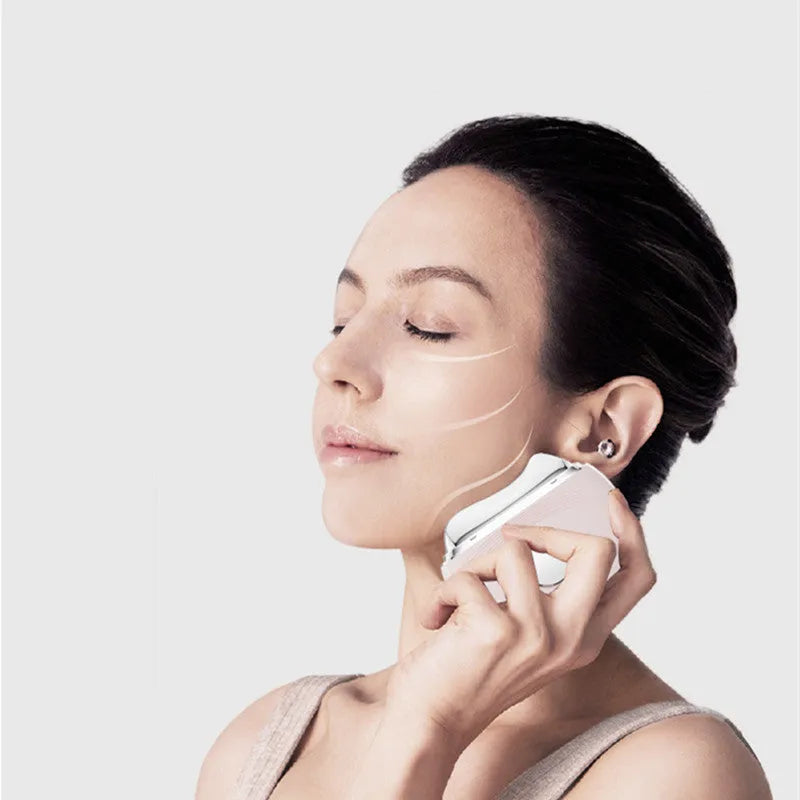 White electric Guasha massager with EMS face lifting, hot and cold scraping and 3 colour phototherapy, USB powered
